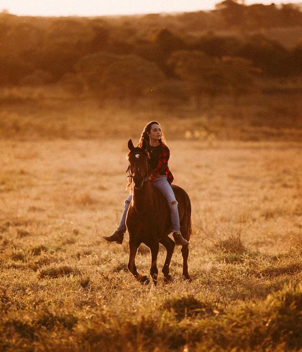 Woman performing a fluid motion exercise in a calm environment.